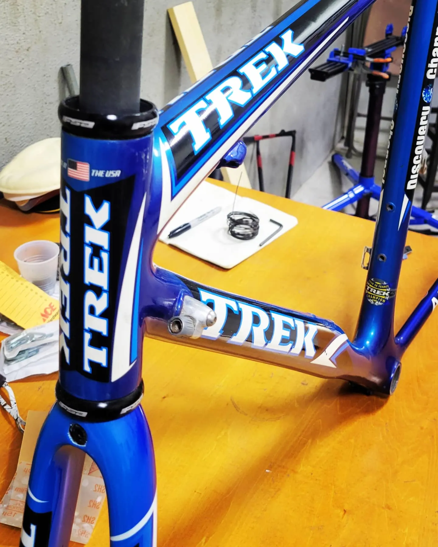 Bike paint design: restored Trek Discovery Channel road frame in blue, black and white team colors